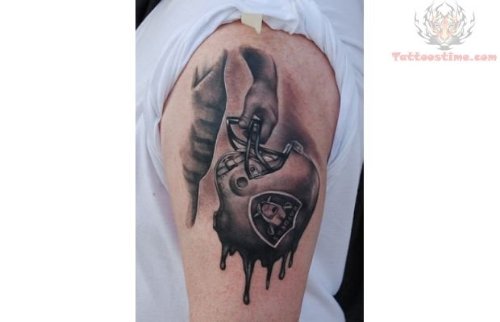 Grey Ink Raiders Helmete Tattoo